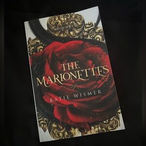 Paperback book The marionettes by Katie Wismer book 1 of series